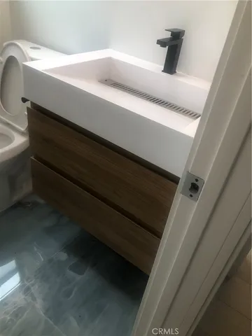 a room with furniture pool table and windows