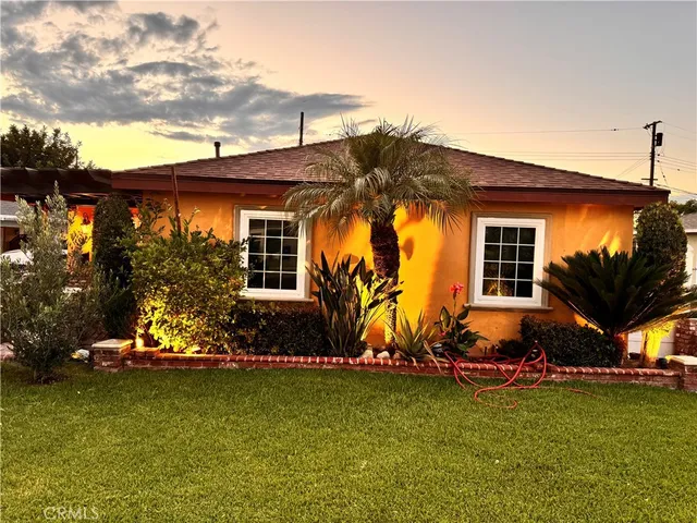 a front view of a house with parking space