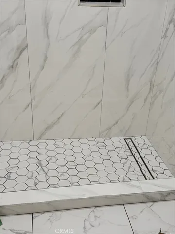 a kitchen with a table chairs and a sink