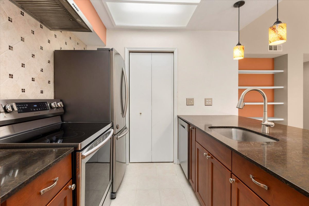 4711 Spicewood Springs Road, Unit 4222 Austin, TX 78759 - Photo 16 of 35 Culinary aspirations come alive in this kitchen featuring abundant counter space and modern appliances.