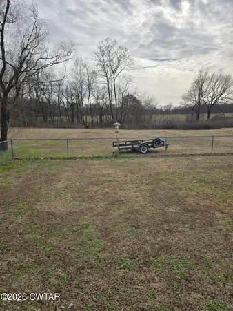 a view of a yard with an trees