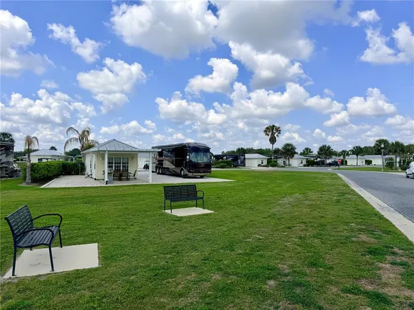 a view of a house with a big yard