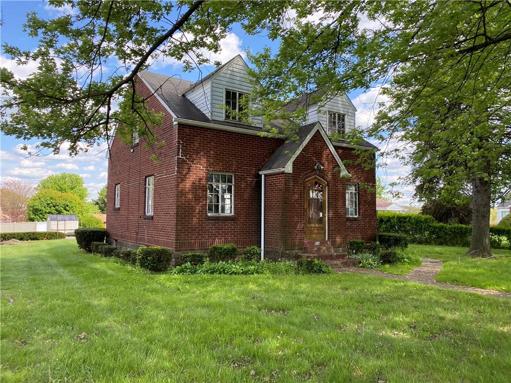 916 Russellton Road Cheswick, PA 15024 - Photo 1 of 10 a front view of a house with garden