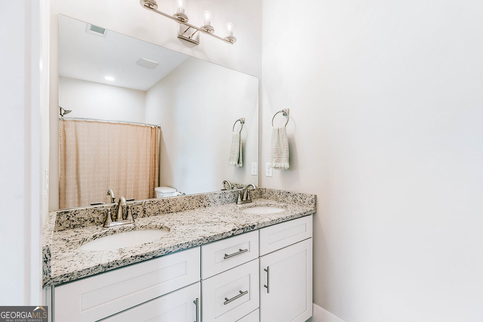 1150 Chivers Road Buckhead, GA 30625 - Photo 3 of 29 a bathroom with a granite countertop sink and a mirror