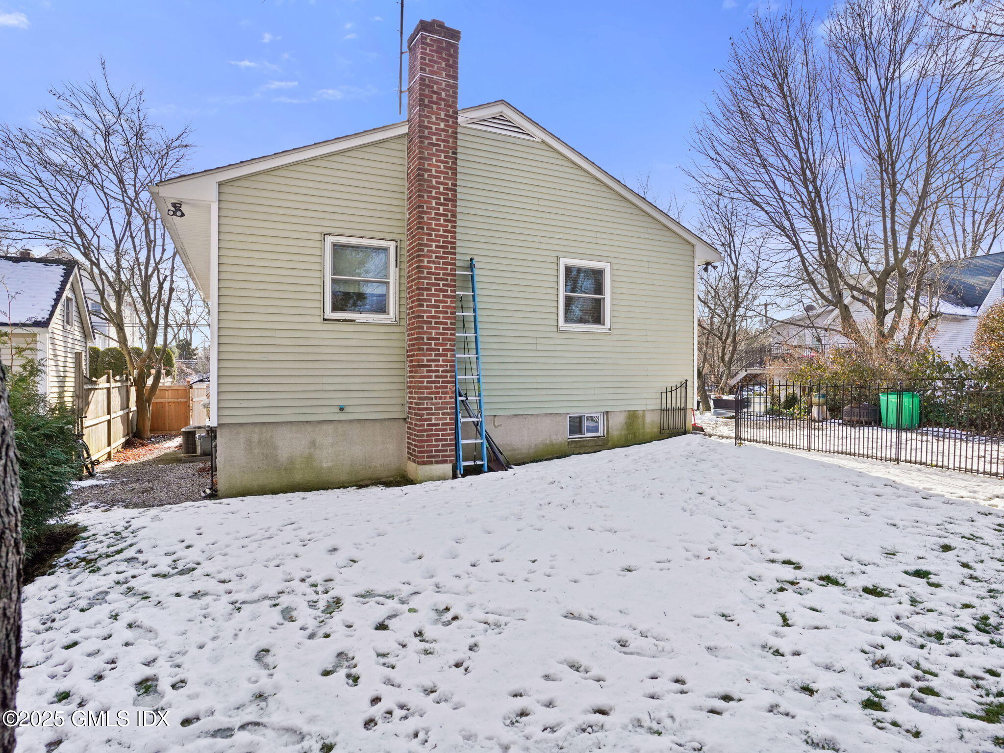 45 Gold Street Greenwich, CT 06830 - Photo 15 of 18 a front view of a house with a yard