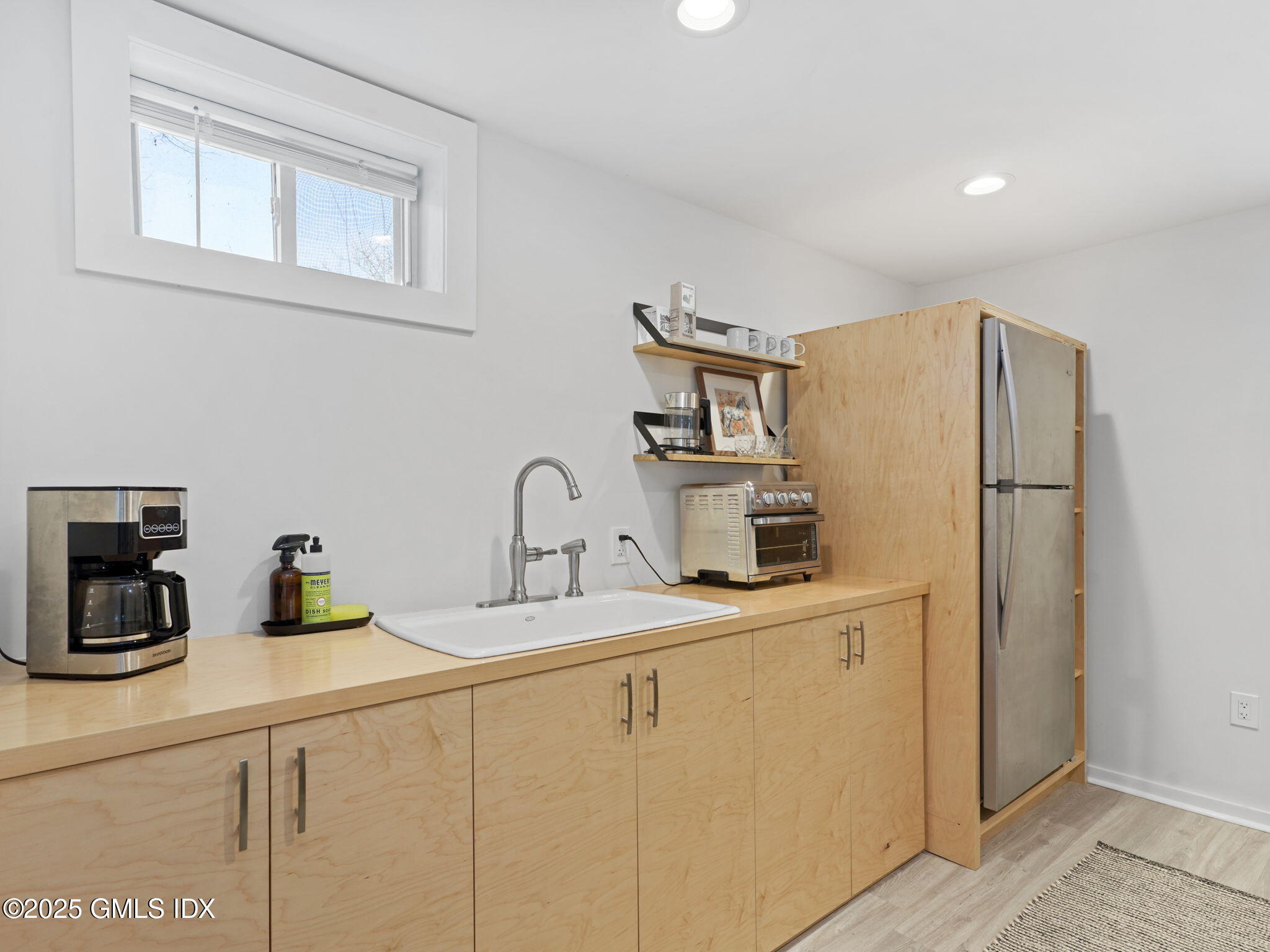 45 Gold Street Greenwich, CT 06830 - Photo 6 of 18 a kitchen with stainless steel appliances a refrigerator sink and cabinets