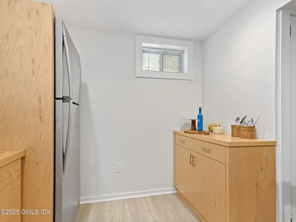 a view of a bathroom with sink and wooden floor