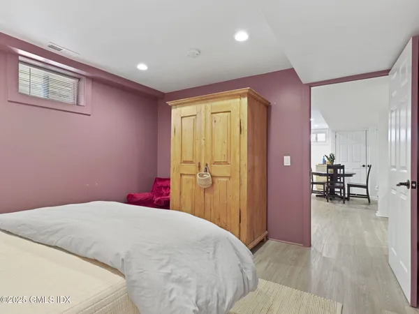 a bedroom with a bed and a table