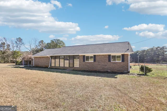 a view of an ocean beach and trees in the background