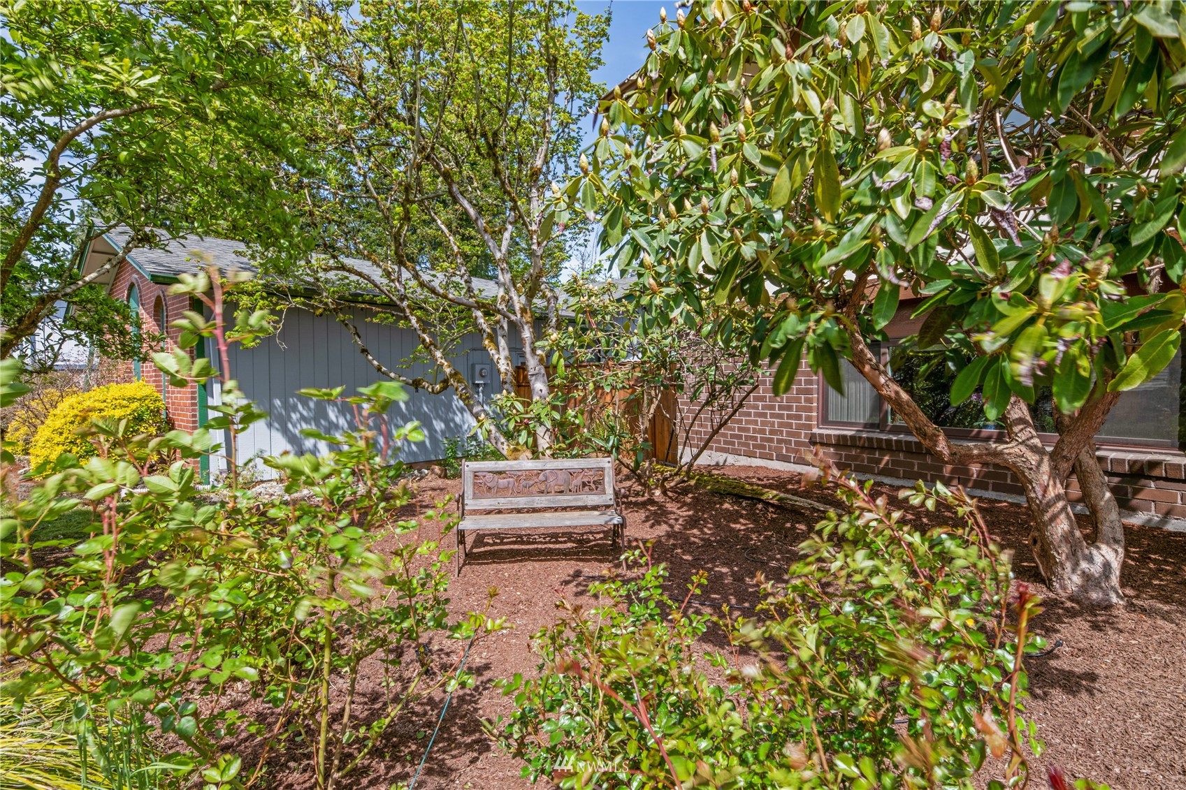 17515 24th Avenue Southeast Bothell, WA 98012 - Photo 35 of 39 a view of a bench in a garden
