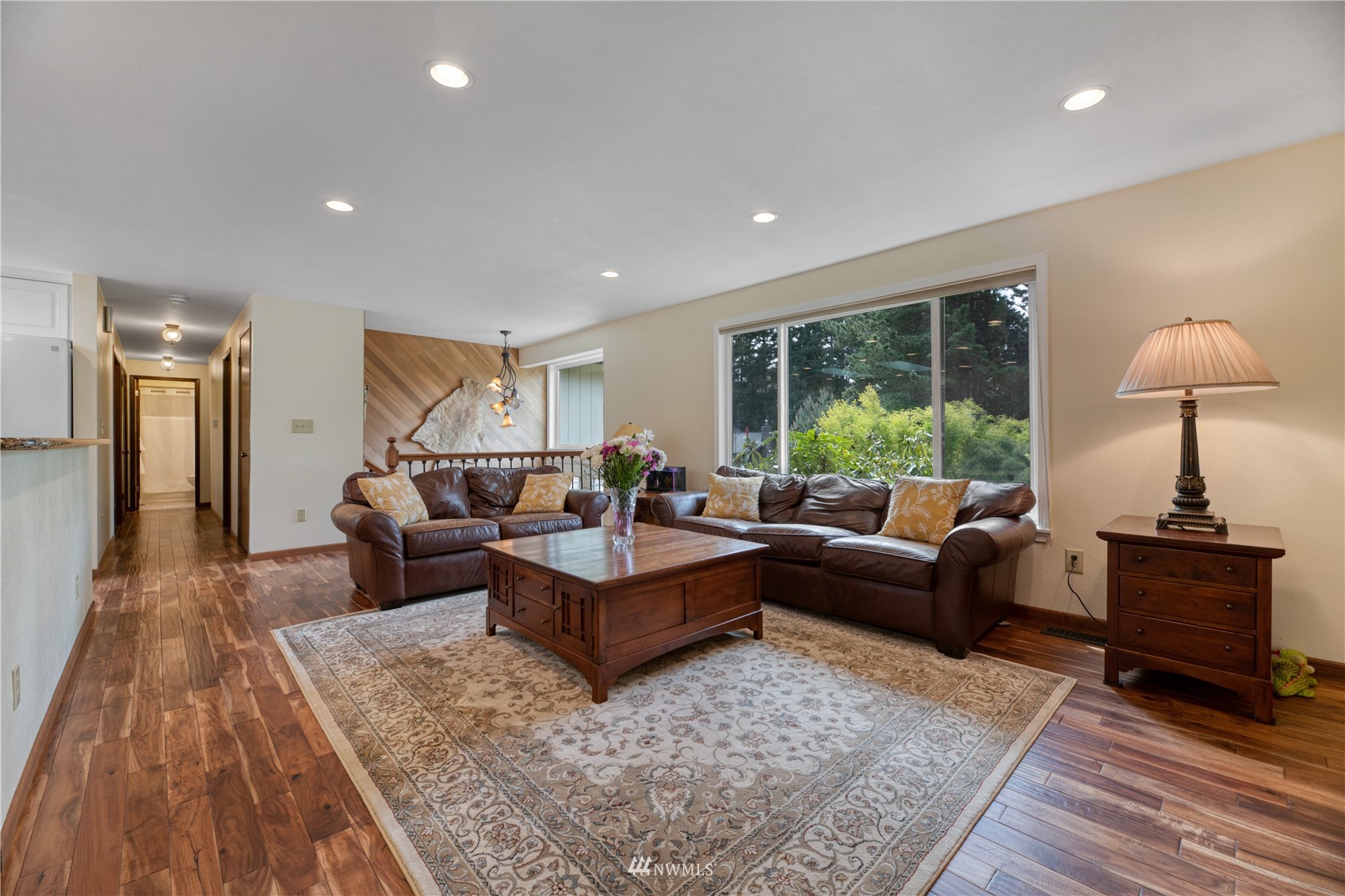 17515 24th Avenue Southeast Bothell, WA 98012 - Photo 4 of 39 a living room with furniture and a large window