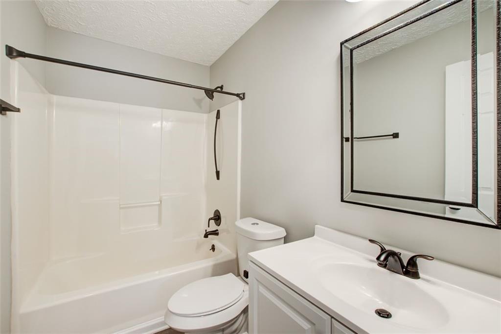 4110 Ridgebrook Bend Cumming, GA 30028 - Photo 36 of 49 a bathroom with a sink toilet and shower