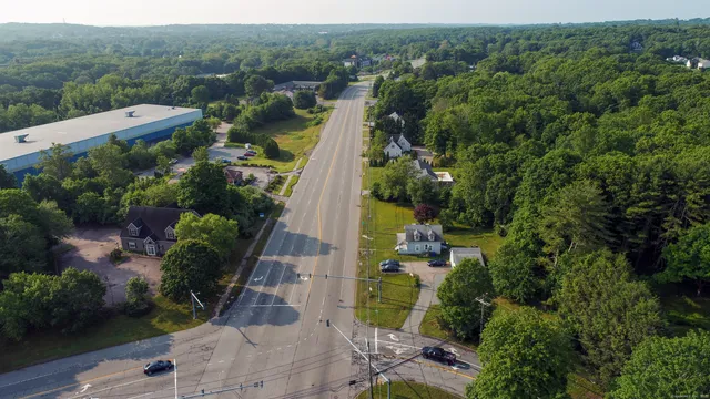 an aerial view of a house with a yard