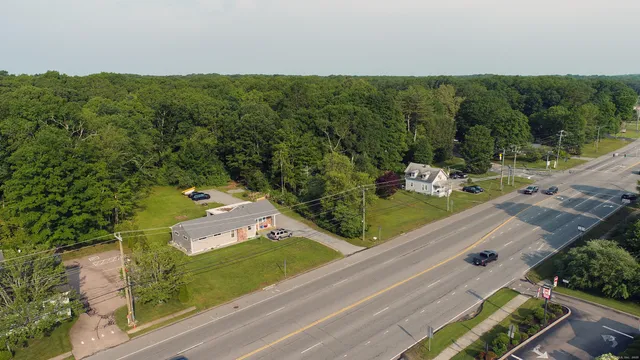 an aerial view of house with yard