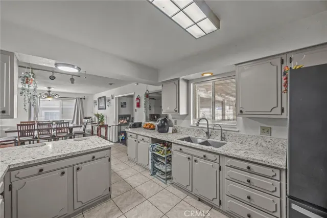 a kitchen with center island and sink