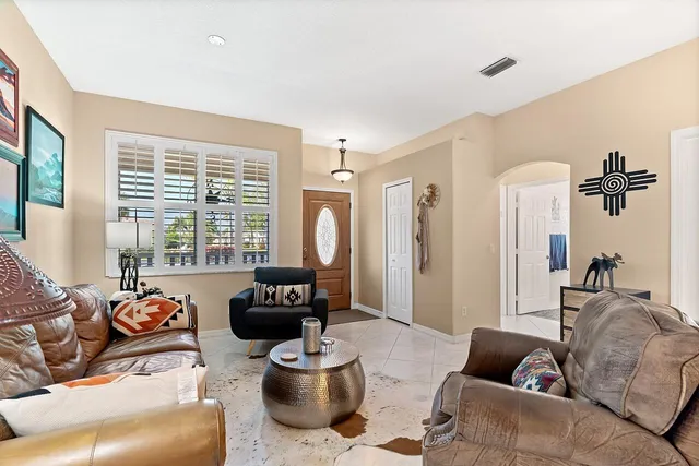 a kitchen with a sink a stove and cabinets