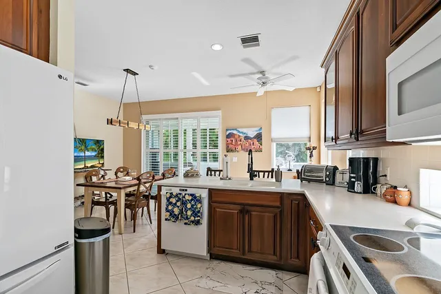 a view of a dining room with furniture and a flat screen tv