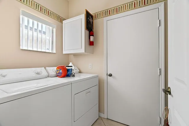 a front view of a house with yard and green space