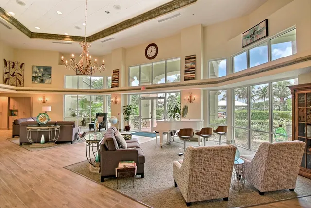 a room with pool table and windows