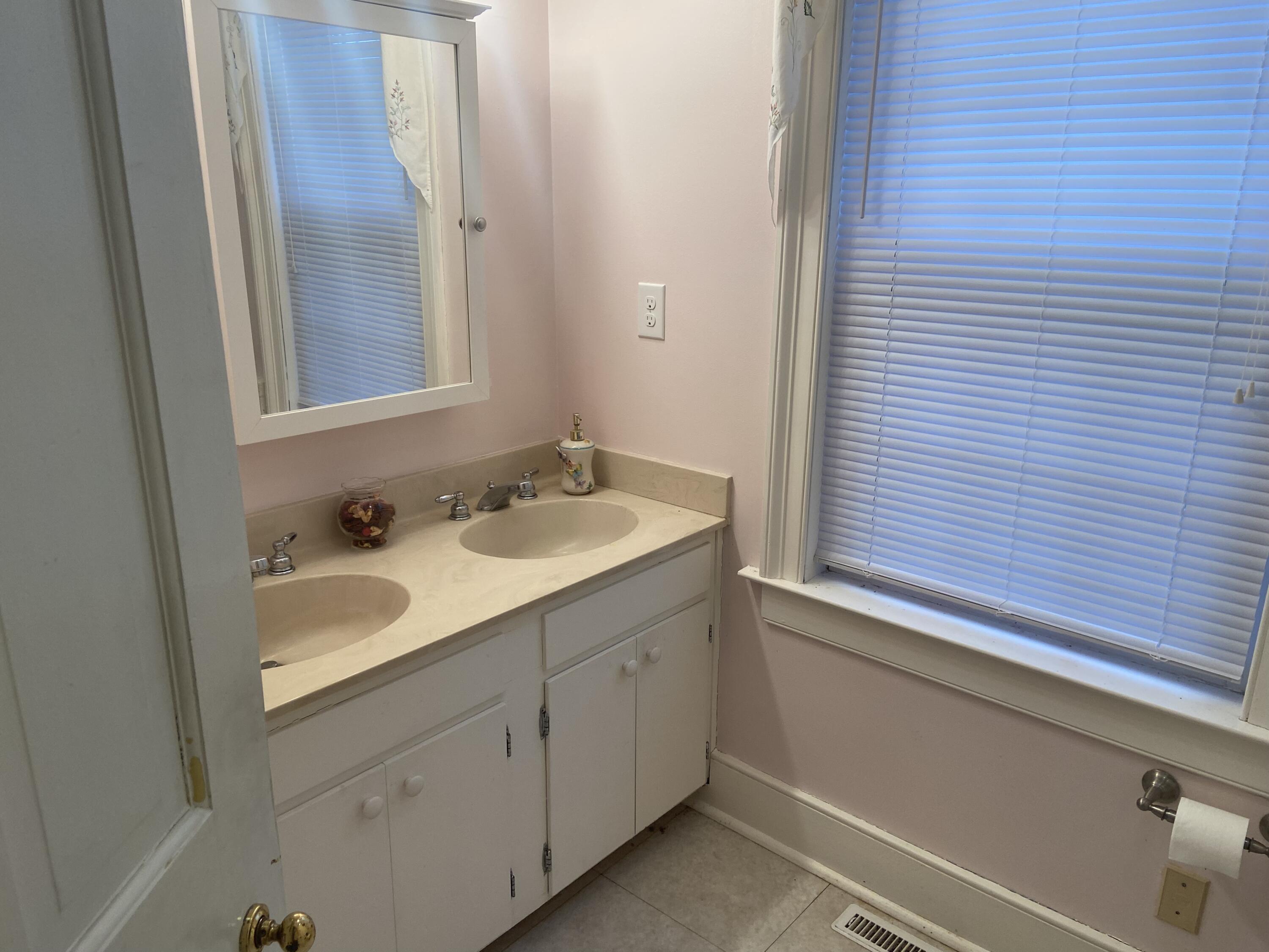 7229 Springwood Road Buchanan, VA 24066 - Photo 19 of 40 a bathroom with a sink and a mirror