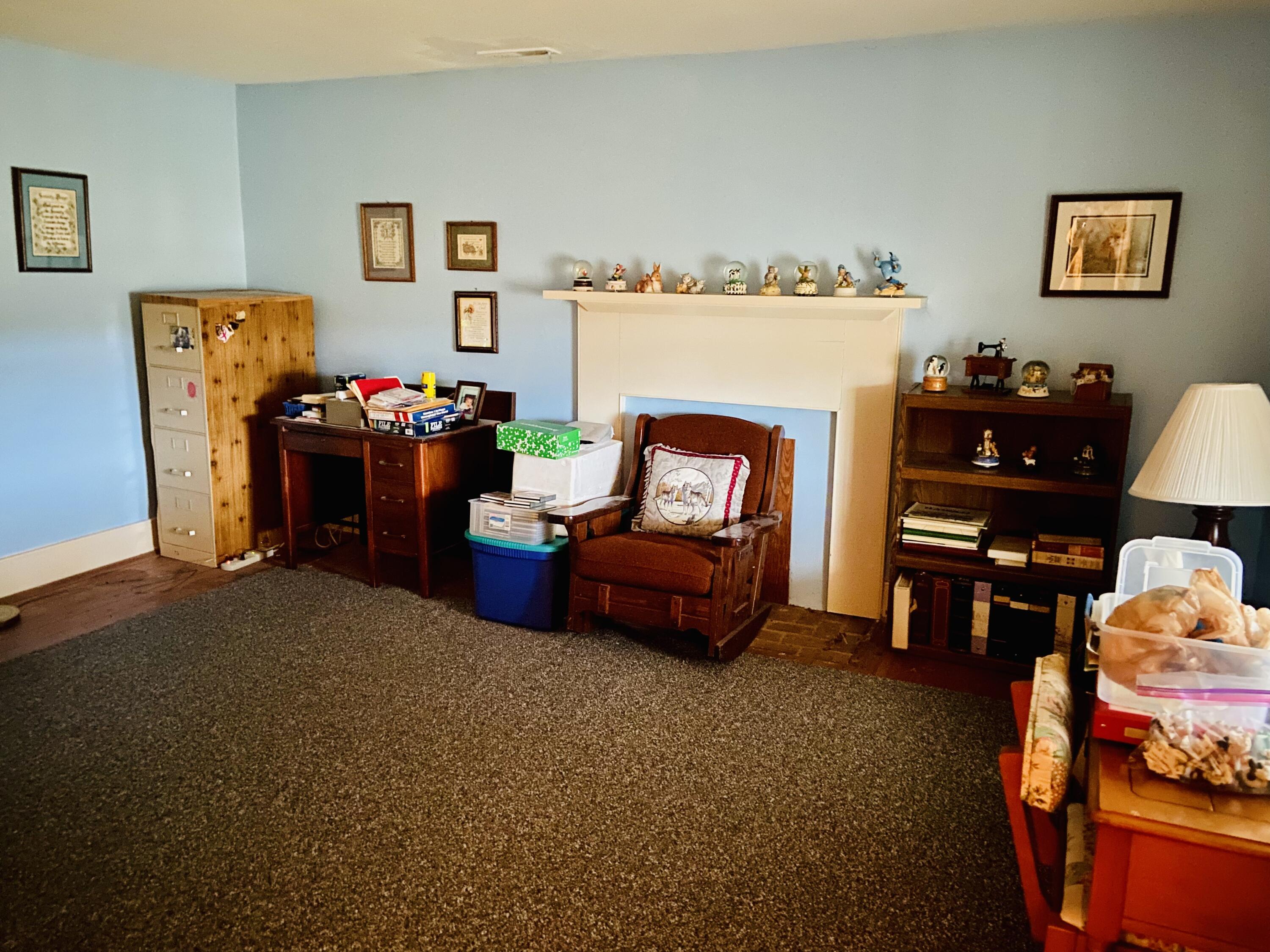 7229 Springwood Road Buchanan, VA 24066 - Photo 20 of 40 a living room with furniture and a fireplace