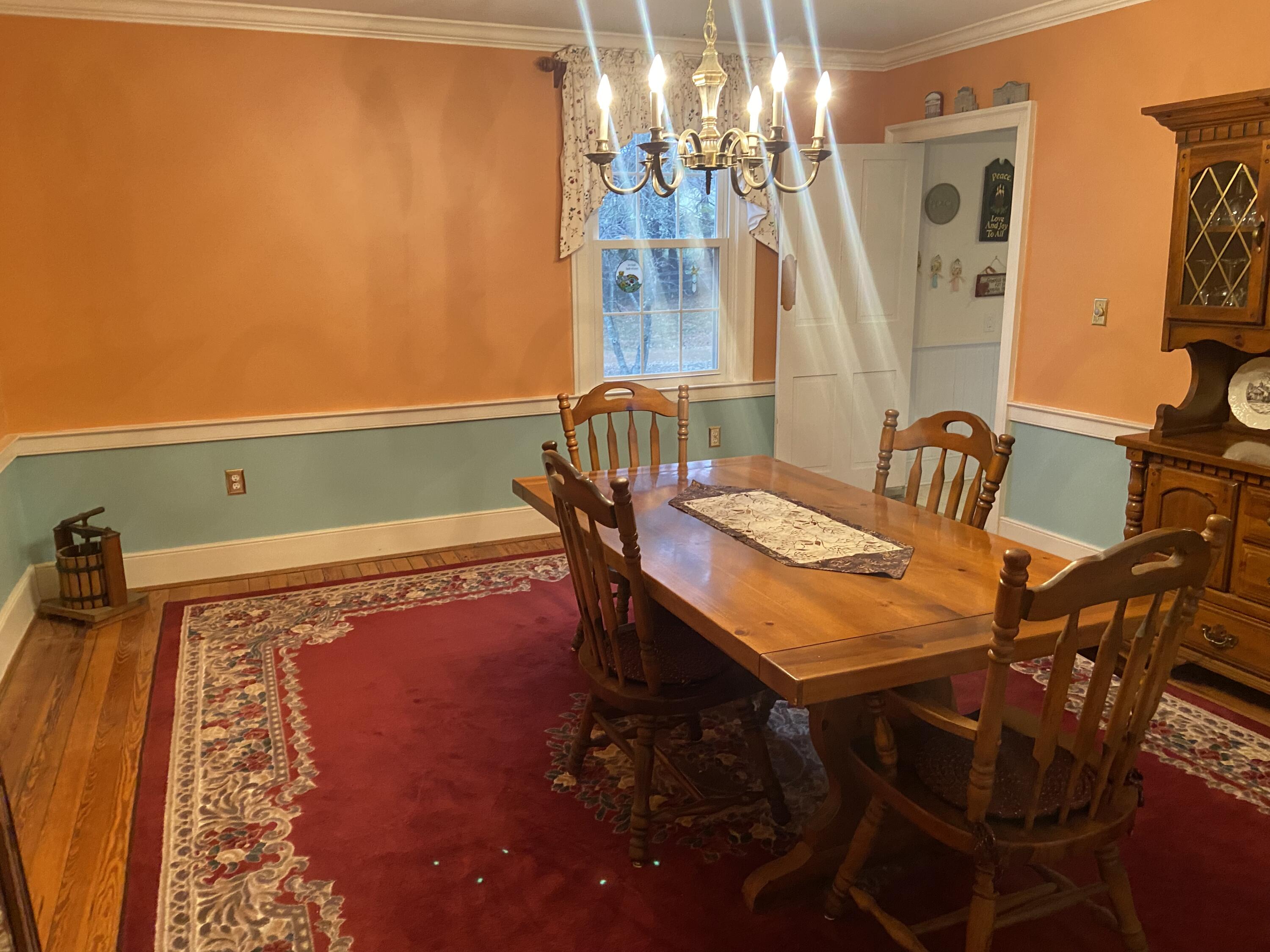 7229 Springwood Road Buchanan, VA 24066 - Photo 25 of 40 a view of a dining room with furniture and a chandelier