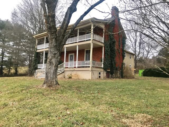 7229 Springwood Road Buchanan, VA 24066 - Photo 3 of 40 a front view of a house with a yard
