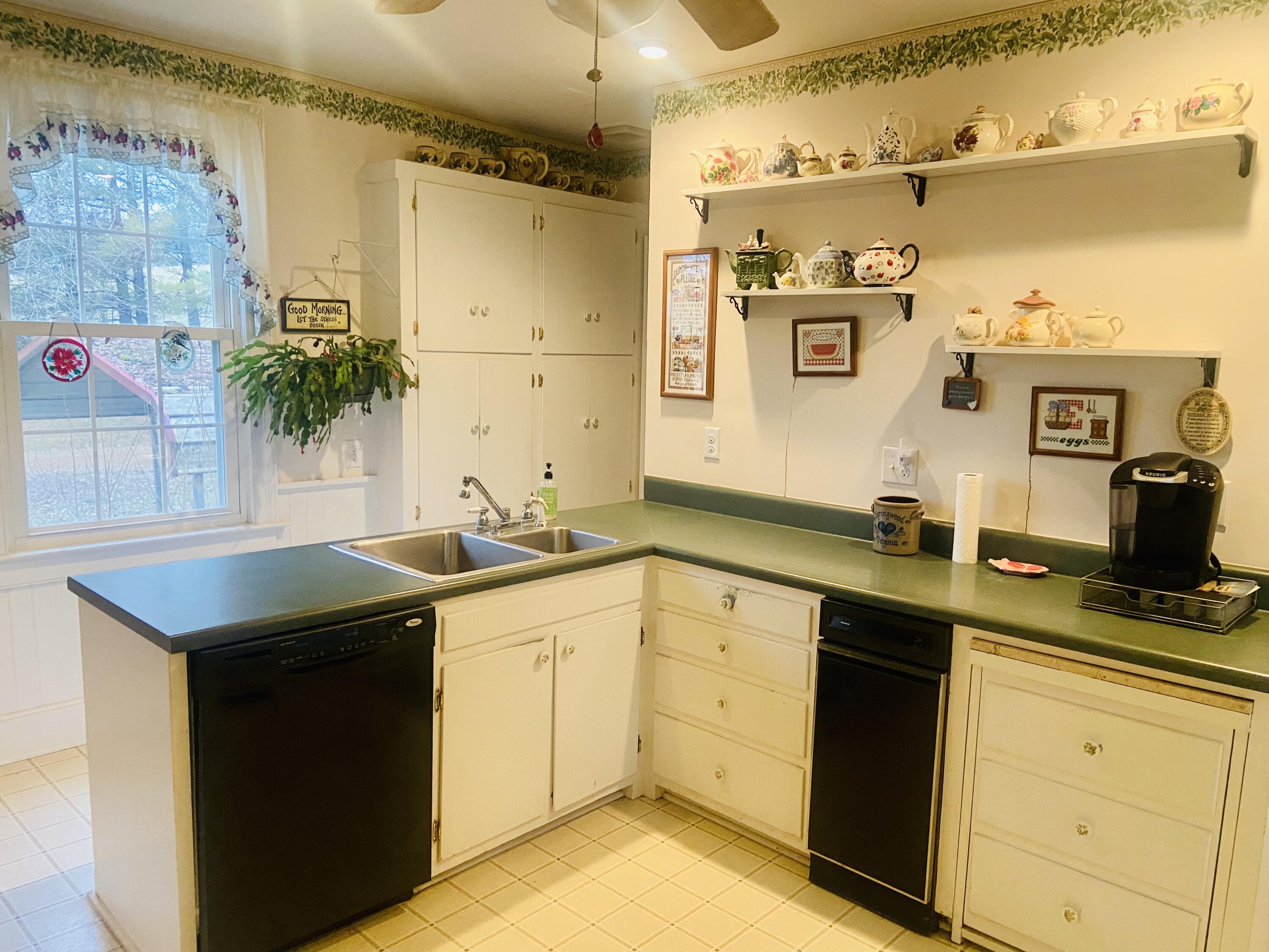 7229 Springwood Road Buchanan, VA 24066 - Photo 36 of 40 a kitchen with a sink and cabinets