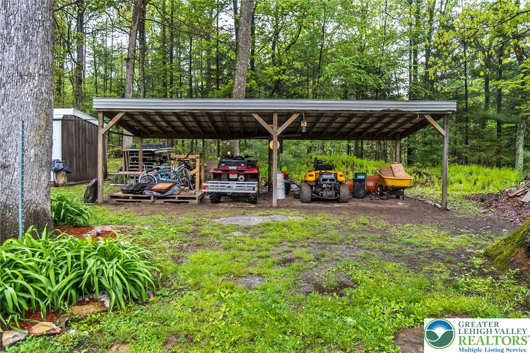 9223 North Loop Road Slatington, PA 18080 - Photo 52 of 60 a view of a patio with table and chairs under an umbrella