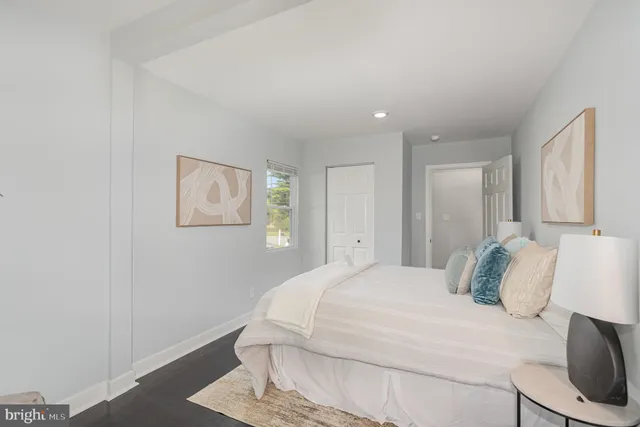 a large white bed in a white room