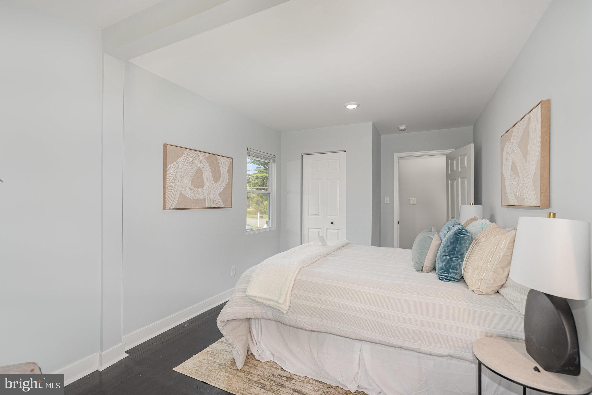 1205 North Point Road Dundalk, MD 21222 - Photo 13 of 19 a large white bed in a white room