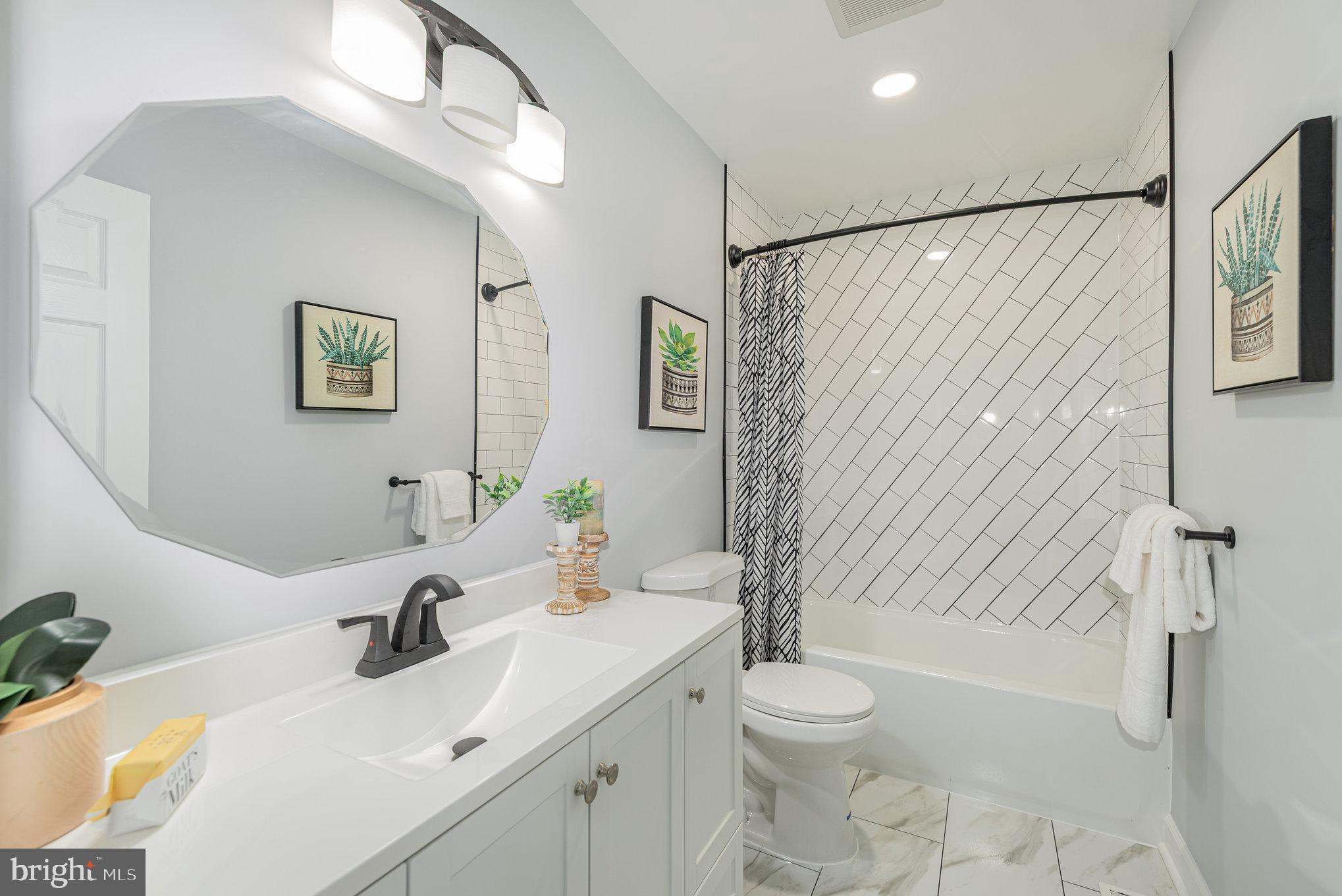 1205 North Point Road Dundalk, MD 21222 - Photo 18 of 19 a bathroom with a sink toilet and shower