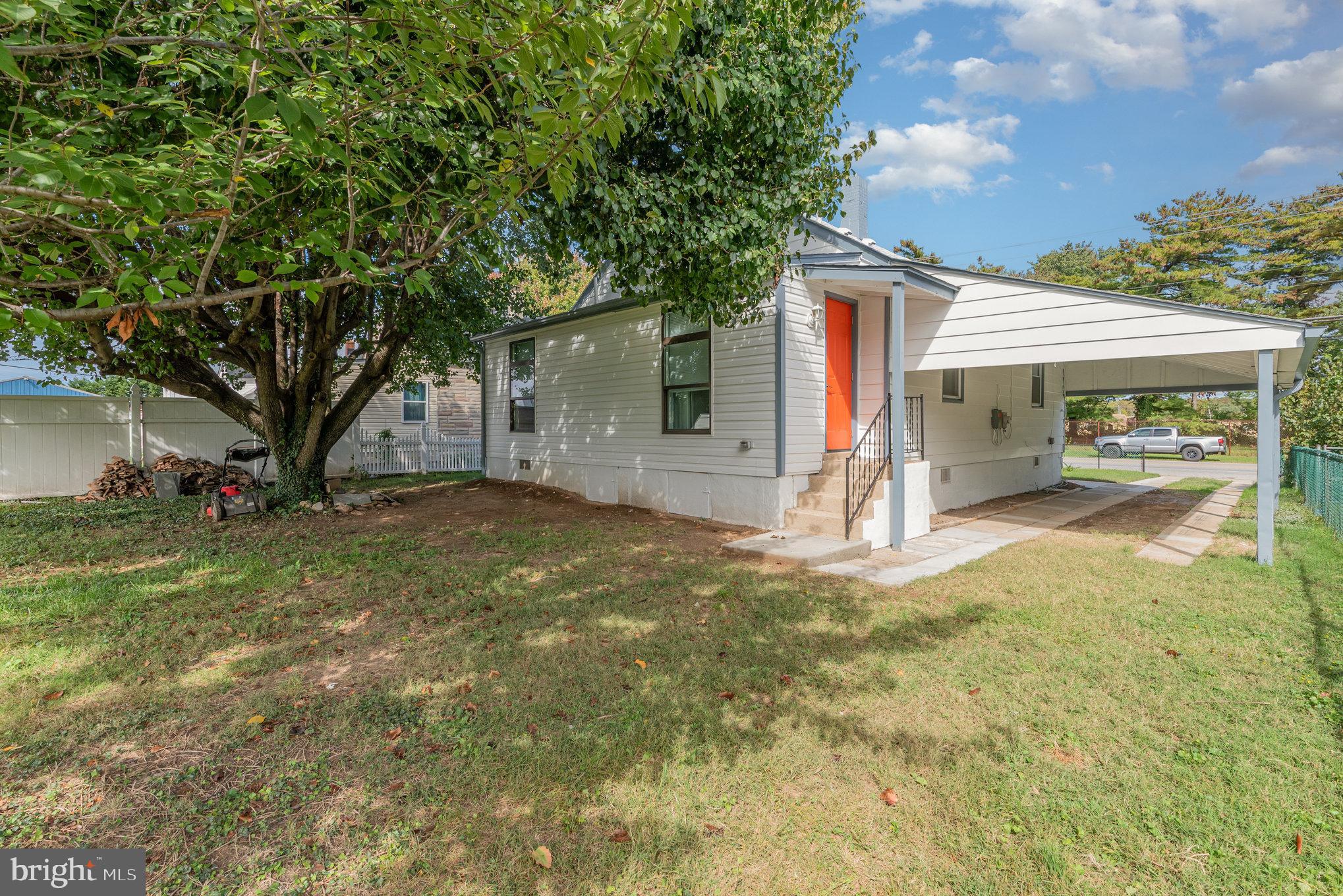 1205 North Point Road Dundalk, MD 21222 - Photo 6 of 19 a view of a house with backyard and a tree