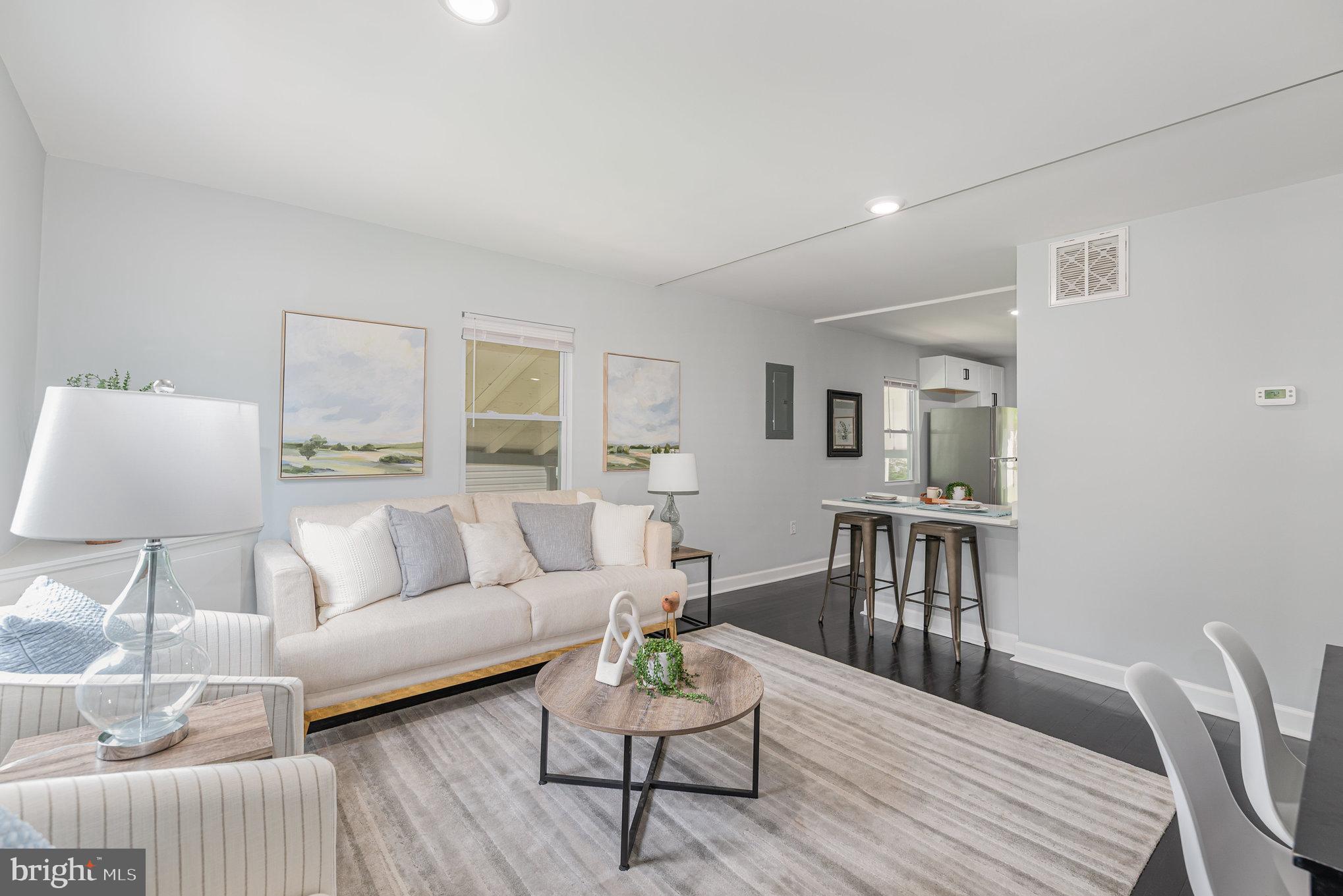 1205 North Point Road Dundalk, MD 21222 - Photo 8 of 19 a living room with furniture and wooden floor