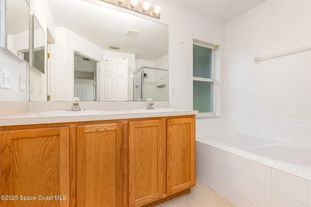 a bathroom with a bathtub and a sink
