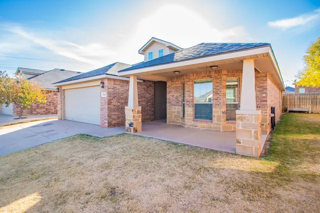 front view of a house with a big yard