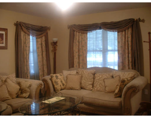 64 Webber Road Brookfield, MA 01506 - Photo 2 of 10 a living room with furniture and a window