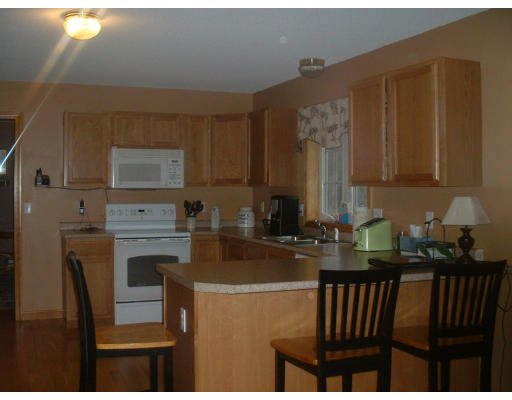 64 Webber Road Brookfield, MA 01506 - Photo 4 of 10 a kitchen with a refrigerator and a stove top oven