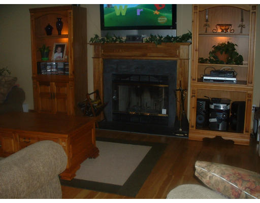 64 Webber Road Brookfield, MA 01506 - Photo 5 of 10 a living room with furniture and a fireplace