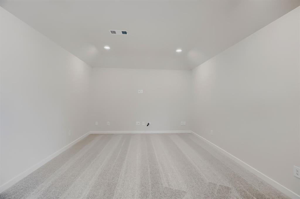 4407 Windy Point Road Oak Point, TX 75068 - Photo 13 of 27 Spacious room featuring light gray carpeting, recessed lighting, white walls, white baseboards, and ceiling-mounted vents