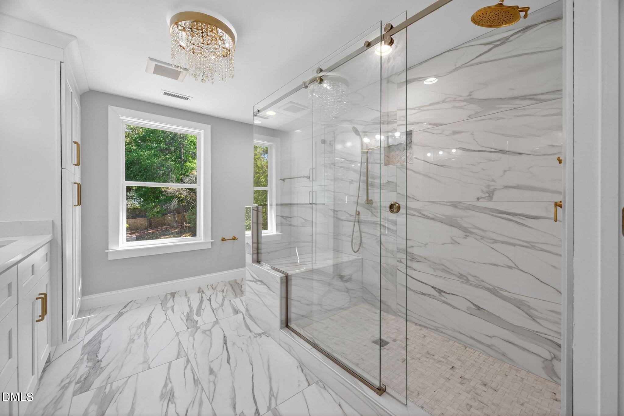 313 Crown Oaks Drive Raleigh, NC 27615 - Photo 19 of 60 a bathroom with a bathtub and a shower