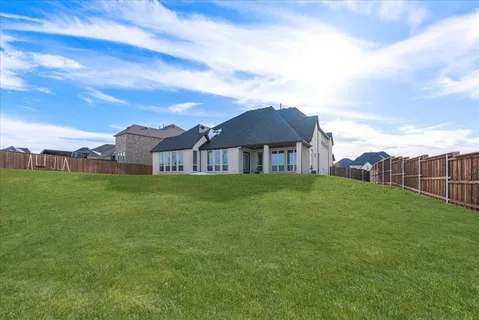 a view of a house with a big yard