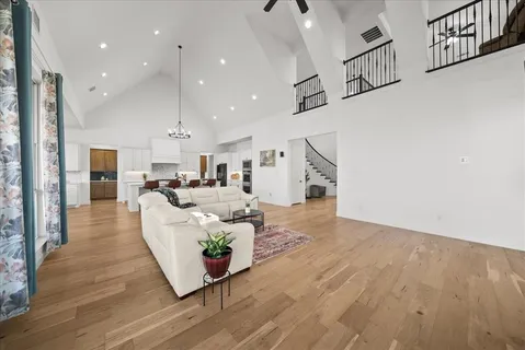 a living room with furniture and kitchen view
