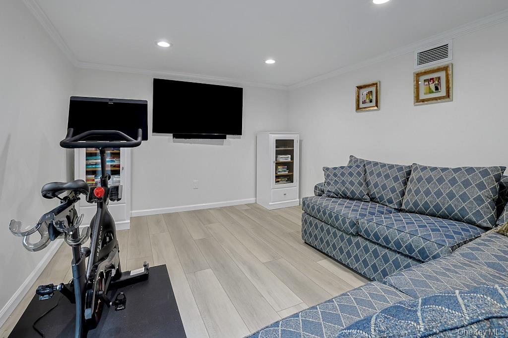 305 Stratton Road New Rochelle, NY 10804 - Photo 26 of 32 a living room with furniture and a flat screen tv