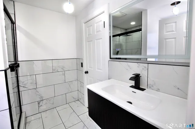 a bathroom with a sink and a mirror