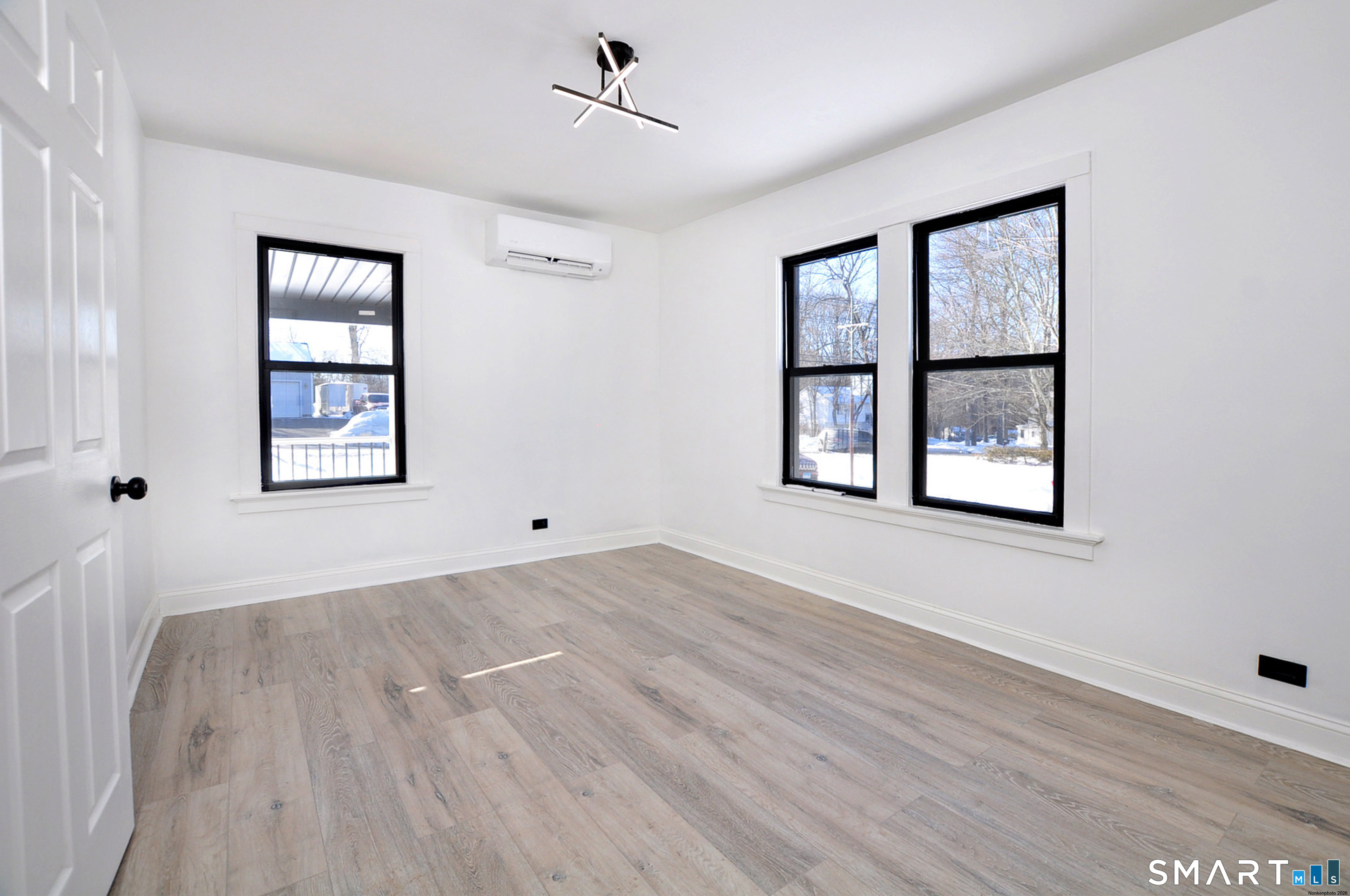 443 Todd Road Wolcott, CT 06716 - Photo 15 of 41 a view of an empty room with a window and wooden floor