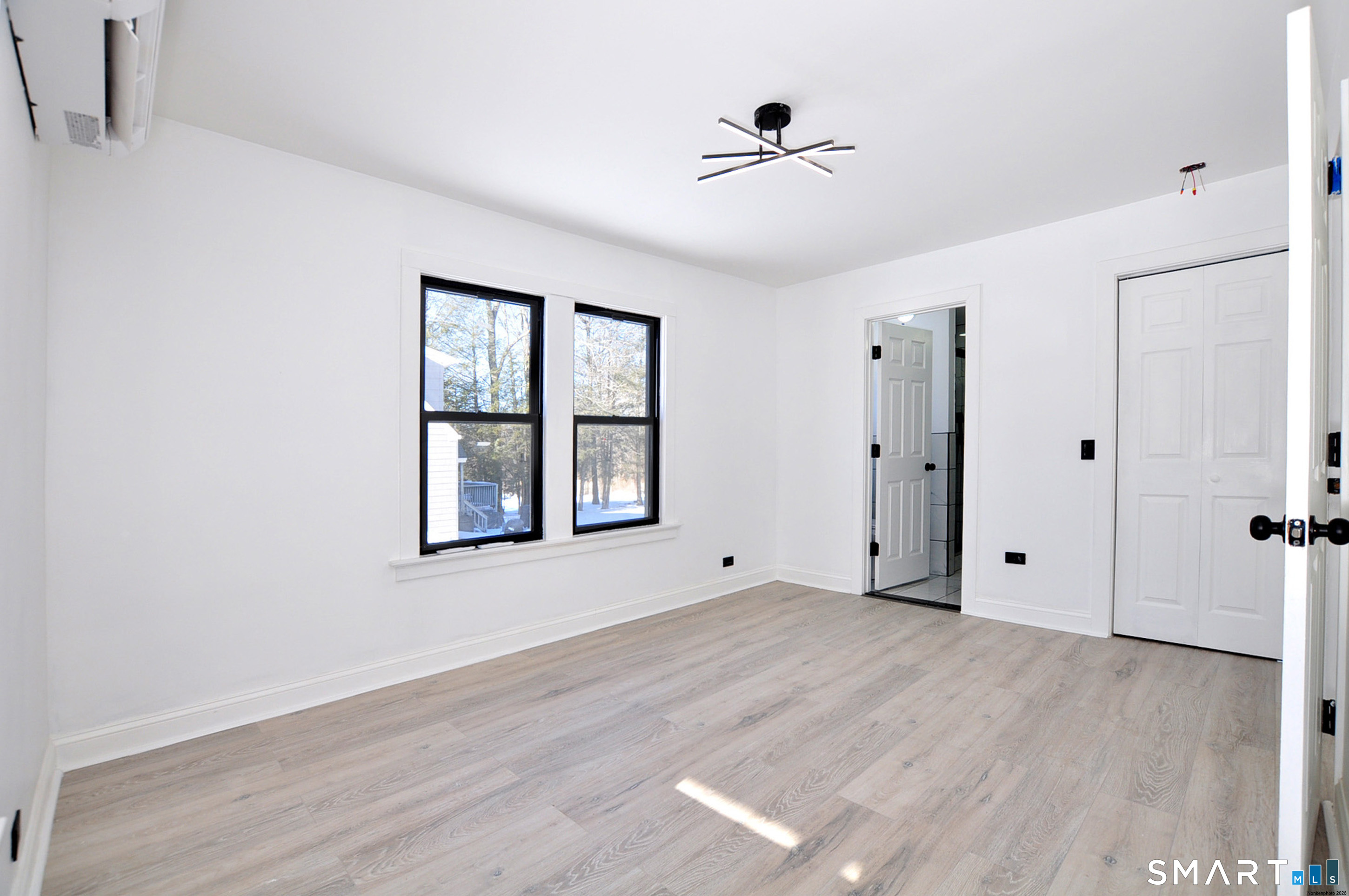 443 Todd Road Wolcott, CT 06716 - Photo 25 of 41 a view of an empty room with a window and wooden floor