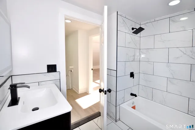 a bathroom with a sink and a bathtub