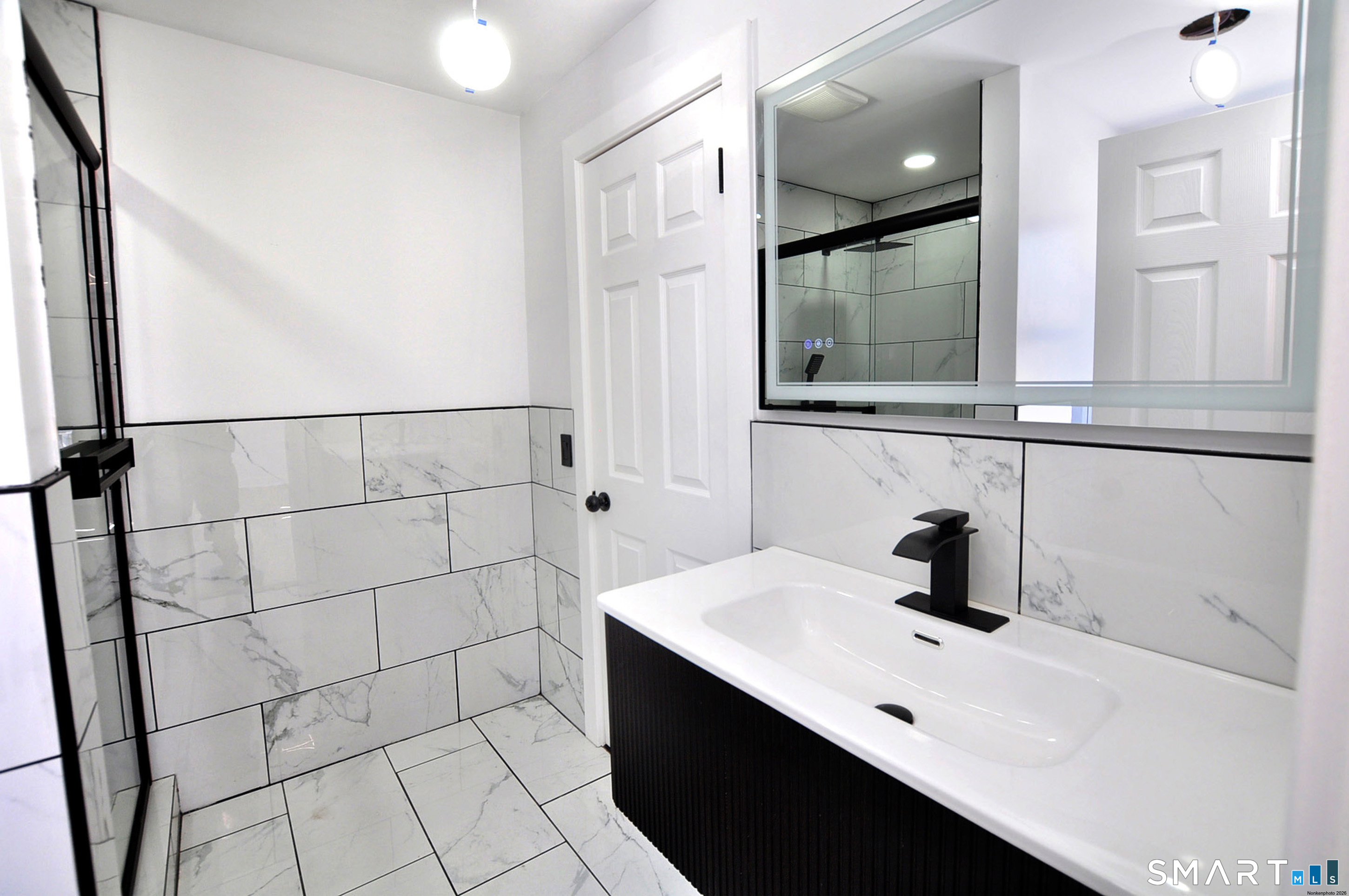 443 Todd Road Wolcott, CT 06716 - Photo 27 of 41 a bathroom with a sink and a mirror