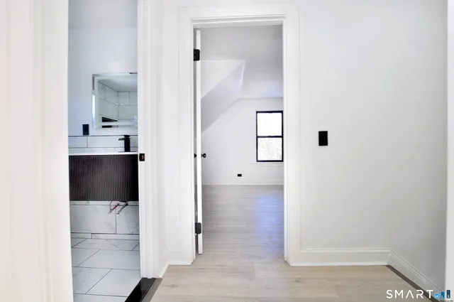 a view of a bathroom with mirror